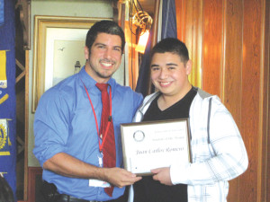 Anselmo Garza Jr. of the Port Isabel Rotary Club recognizes Juan C. Romero as Student of the Month.