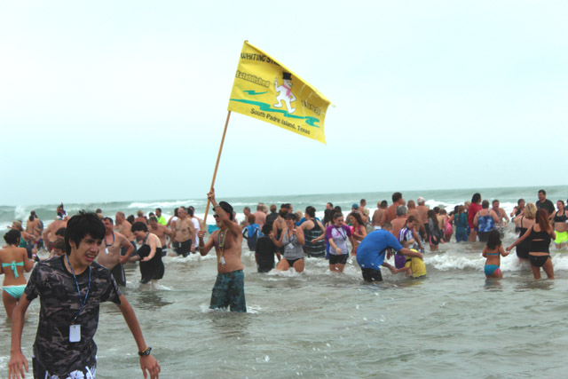Hundreds braved the cold Tuesday when they took to South Padre Island beaches to celebrate the New Year by participating in the annual Polar Bear Dip and a new event called the Penguin Plunge. Seen here are various scenes from said festivities. (Staff photos by Craig Alaniz)
