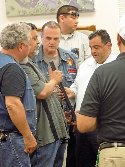 Port Isabel Mayor Joe E. Vega presents members of Bikers for Christ with a proclamation declaring May Motorcycle Safety and Awareness Month. (Staff photo by Estevan Medrano).